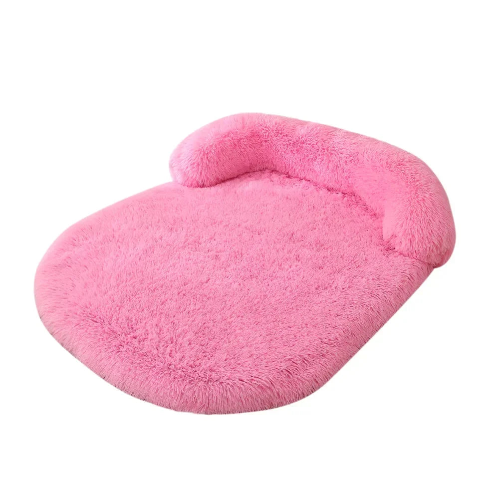 Pink fluffy pet bed on a white background