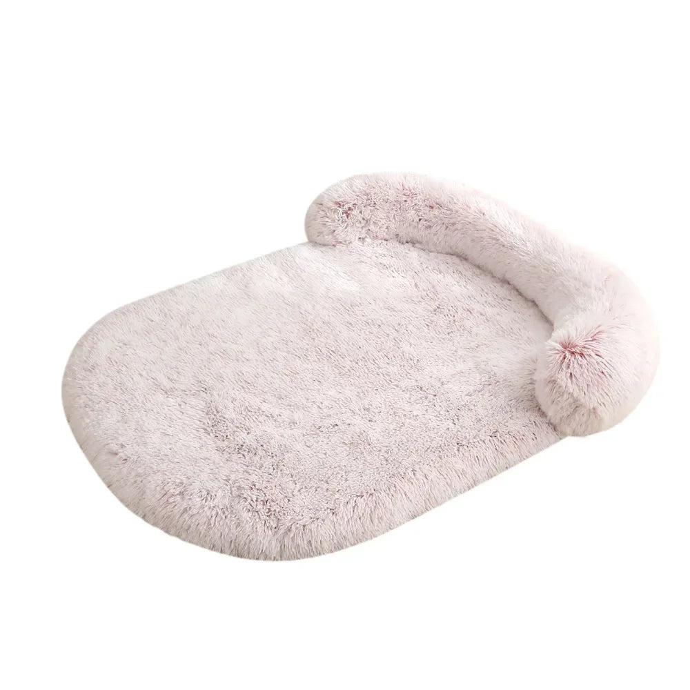 Fluffy pink orthopedic pet bed on a white background