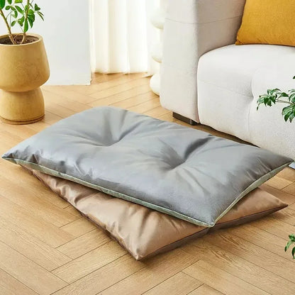 Gray and beige Cooling Cushion for Dogs and Cats on a wooden floor with a white sofa and plant in the background.
