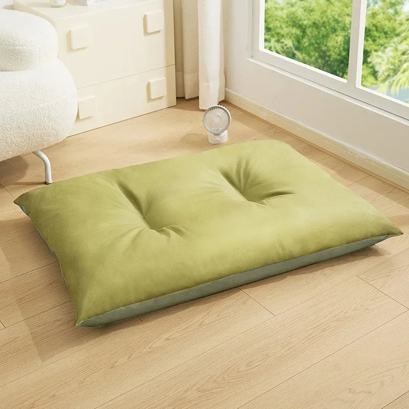Light Green Cooling Cushion on a wooden floor with a window in the background