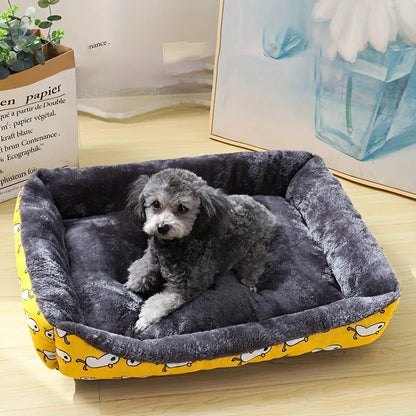 Dog lying on a gray pet bed with yellow edge in a room setting.
