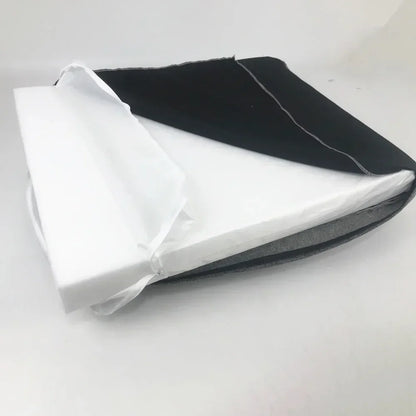 Folded black and white fabric on Dog Mattress