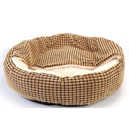 Beige pet bed with textured surface on a white background