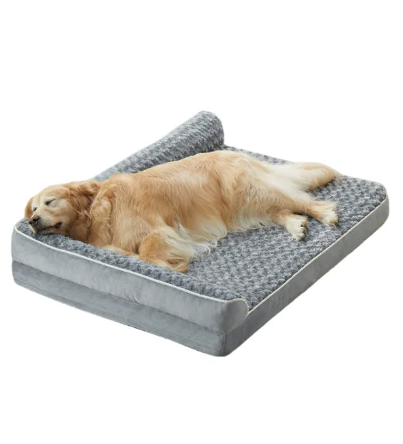 Dog lying on a gray Orthopedic Mattress with a white background
