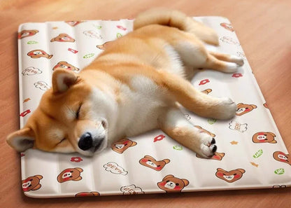Dog lying on a patterned cooling mat with cartoon bears